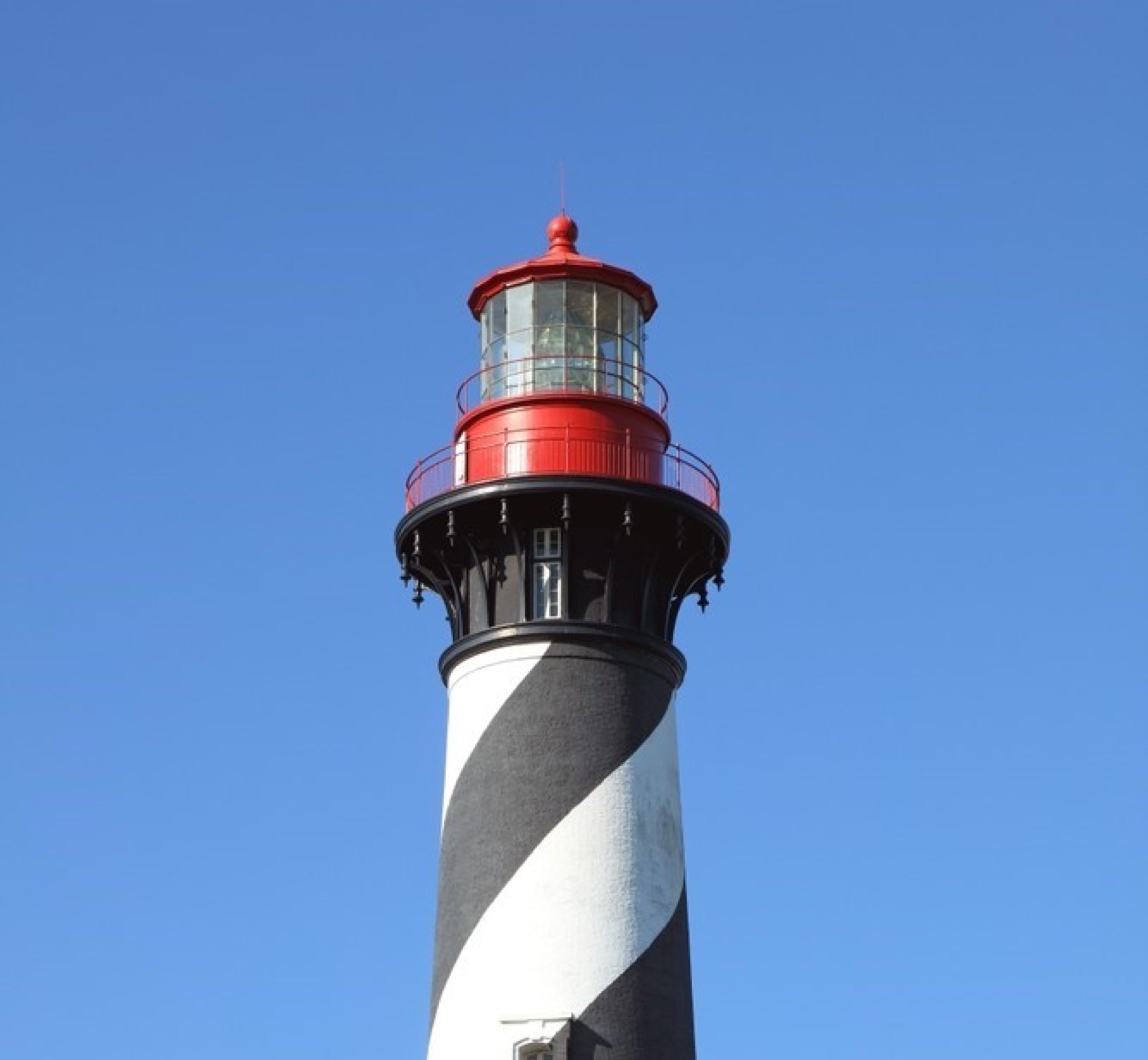 The St. Augustine Lighthouse against a clear blue sky